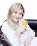 Beautiful woman drinking an orange jus 