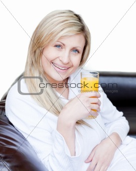 Beautiful woman drinking an orange jus 