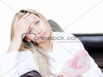 Pensive woman have a headache