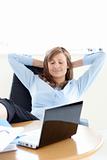 Relaxed businesswoman looking at the laptop