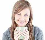 Cute woman holding a cup a coffee 