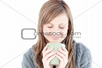 Smiling woman holding a cup a coffee 