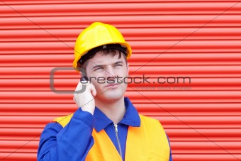 Attractive male engineer talking on the phone