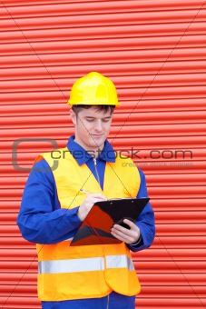 Self-assured male engineer writing his report 