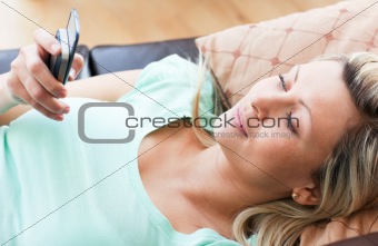 Cheerful woman using a phone