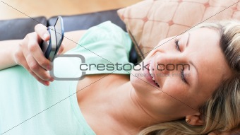 Smiling woman using a phone