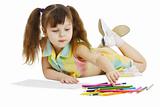 Little girl draws with crayons