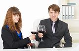 Clerks drink wine in office - celebrate