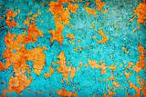 Abstract texture - wall covered with peeled blue and orange pain