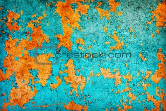 Abstract texture - wall covered with peeled blue and orange pain
