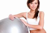 Young woman in doing fitness exercises with pilates gym ball 