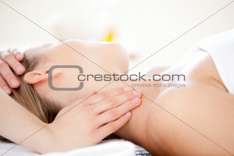 Close-up of a caucasian woman receiving a head massage 