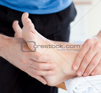 Close-up of a woman enjoying a foot massage 