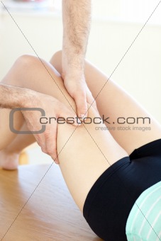 Close-up of a caucasian woman receiving a leg massage