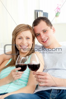 Loving couple drinking red wine