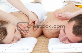 Relaxed couple receiving a back massage