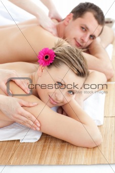 Attractive young couple receiving a back massage