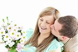 Enamored man giving a bouquet to his girlfriend 