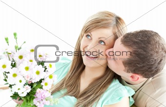 Caring man giving a bouquet to his girlfriend 