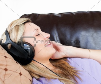 Smiling woman using headphones 
