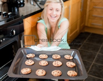 Smiling housewife preparing cookies