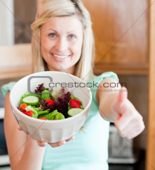 Cute woman having an healthy dinner at home