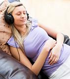 Sleeping woman using headphones 