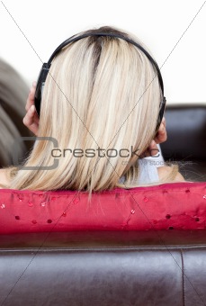 Concentrated woman using headphones 