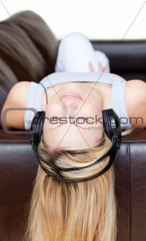 Radiant woman using headphones 