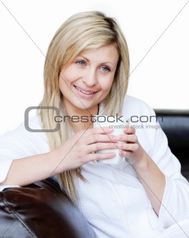Lively woman holding a cup of coffee 