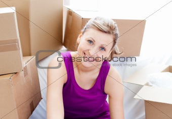 Beautiful woman unpacking box 