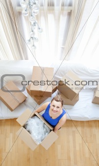 Young woman holding a box 