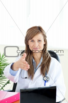 Cute female doctor looking at the camera