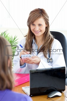 Happy female doctor doing a diagnosis 