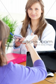 Radiant female doctor doing a diagnosis
