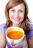 Happy woman holding a soup bowl 