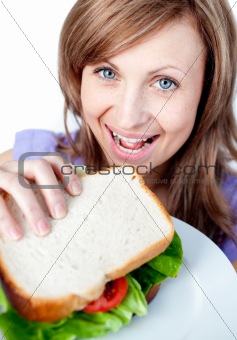 Beautiful woman holding a sandwich 