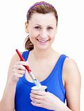 Attractive woman using a paintbrush 