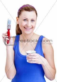 Bright woman using a paintbrush 