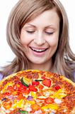 Radiant woman holding a pizza