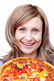 Happy woman holding a pizza