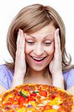 Smiling woman holding a pizza