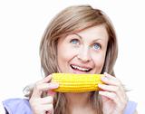 Radiant woman holding a corn 