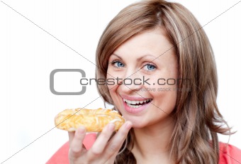 Bright woman eating a cake