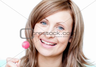 Smiling woman holding a lollipop 