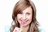Attractive woman holding a lollipop 