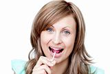 Joyful woman holding a lollipop 