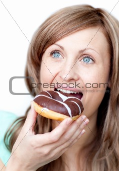 Caucasian woman eating a cake