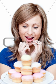 Impatient woman eating a cake