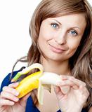Bright woman holding a bananna 